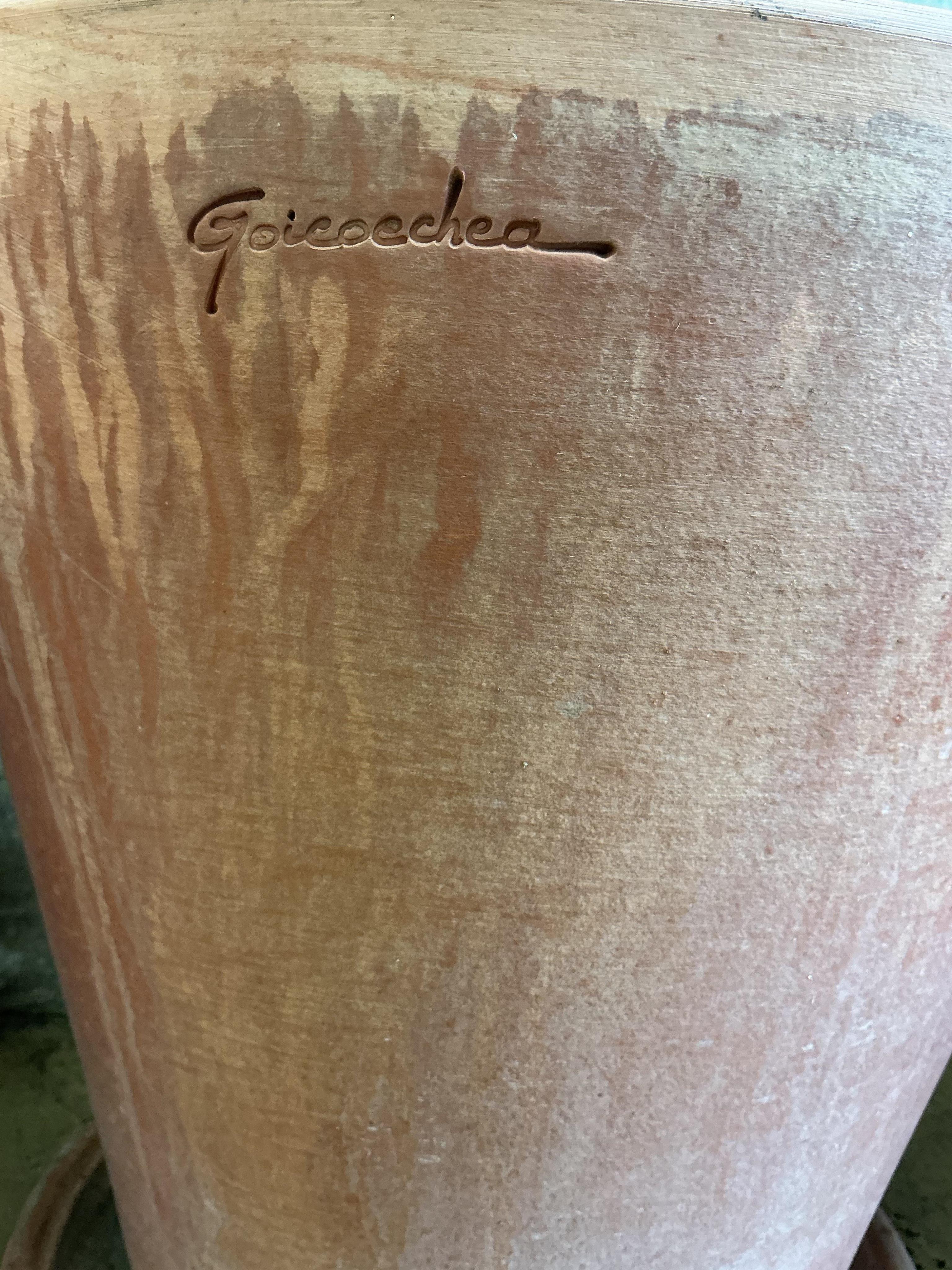 A pair of Goicoechea circular pottery planters with tray bases, diameter 39cm, height 38cm